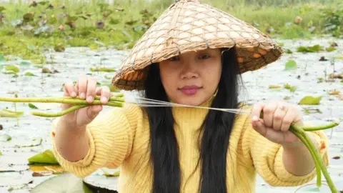 The start-ups working on cheap innovation Bijayshanti Tongbram Bijayshanti Tongbram shows the fibres in a lotus stem