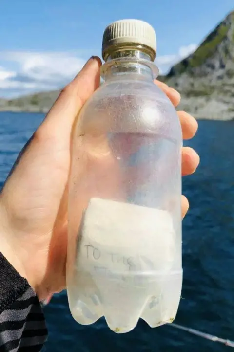 Moray schoolgirl's message in a bottle gets reply from Norway 31 years later Pia Brodtmann Message in a bottle, being held by a hand.