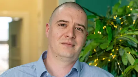Hopes to open NHS ketamine clinic for treatment resistant depression A photo of Sean Gillen looking directly at the camera. He has a shaven head and wears an open-necked shirt