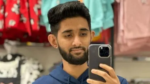 Habibur Masum admits killing wife as she pushed pram in Bradford Other Habibur Masum holds a phone in front of his face to take a picture