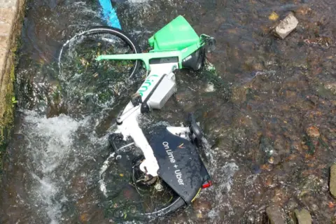 Lime bikes dumped in canals and rivers 'posing pollution risk' Toni Robinson A Lime bike in a shallow part of the River Leen in Nottingham