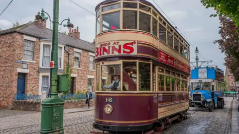 Open-air attraction in County Durham wins Museum of the Year Getty Images Visitors travel on a vintage electric tram in the 1900s village at Beamish Museum on August 28, 2024 in Stanley, United Kingdom