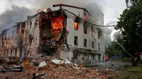 Russia launches biggest drone attack on Ukraine's Kharkiv Reuters Firefighters attempt to put out a blaze at a building hit by a Russian drone strike