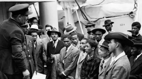 Government announces first Windrush commissioner PA Media File photo dated 22/06/48 of Jamaican immigrants welcomed by RAF officials from the Colonial Office after the ex-troopship HMT Empire Windrush landed them at Tilbury