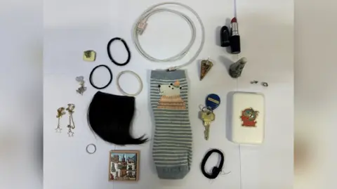 PhD student Zhenhao Zou, who raped 10 women, jailed for 24 years Metropolitan Police A collection of random items on a table, including jewellery and clothing.