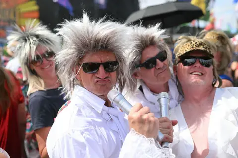 Old school charm from another era Getty Images Fans dressed as Rod Stewart