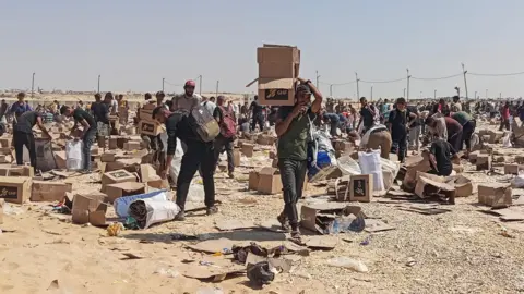 Three journalists among five killed in Israeli strike on Gaza hospital Reuters Palestinians collect remains of aid supplies handed out at a distribution centre of the Gaza Humanitarian Foundation, in Rafah, in the southern Gaza Strip (5 June 2025)