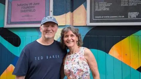 Fans and musicians share memories of Sheffield's The Leadmill BBC A man and woman stood in front of a painted wooden doorway