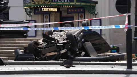 Man critically injured in BMW crash PA Media A black car crashed in Piccadilly Circus