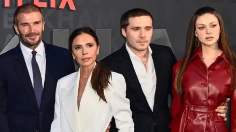 Can the Beckham brand survive reports of family feud? Getty Images David and Victoria Beckham pose with Brooklyn Beckham and Nicola Peltz at the premiere of David’s self-titled 2023 Netflix documentary