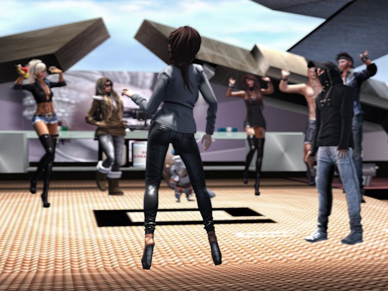 Video games teach students in this class how religion works in the modern world Several robot-like figures stand in a circle, some with their hands raised.