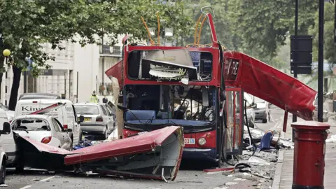 Olympics joy turned into a barbaric loss of life Dylan Martinez/Reuters/Pool/PA A bus has its roof blown off with debris all around