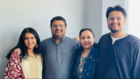 Families of Air India crash victims seek answers after report Inayat Syed, 49, with his wife Nafeesa, along with their son and daughter