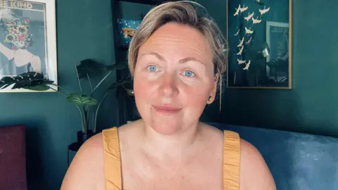 More price rises on the cards in Oxfordshire Patti Miskolczi Patti sits in a teal living room with a plant and pictures behind her. She is smiling slightly and wears a strappy yellow top.