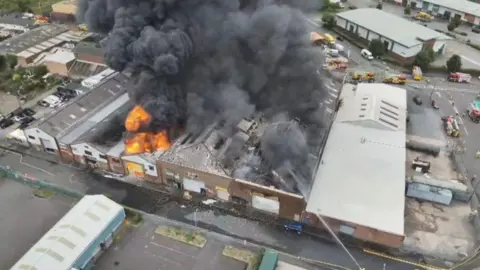 Homes evacuated as factories and tyres burn near Tipton West Midlands Fire Service Aerial shot of the factory fire