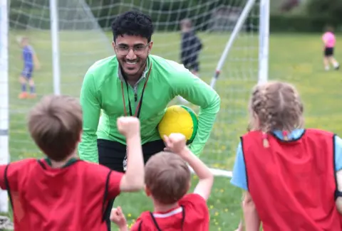 How to get one when you have zero work experience Getty Images A young male football coach talking to group of children in sports ground