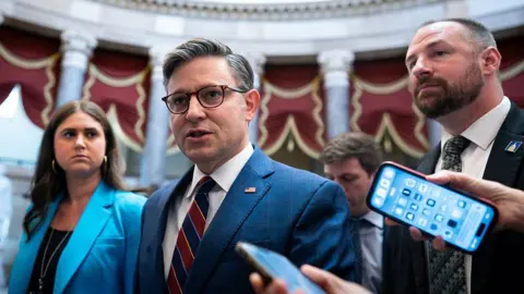 US passes Genius Act, first major national crypto legislation Getty Images US House Speaker Mike Johnson, a Republican from Louisiana, speaks to members of the media while walking to the House Chamber during a vote at the US Capitol in Washington, DC, US, on Thursday, July 17, 2025.
