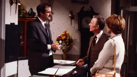 Your new banknote ideas - from British Bulldogs to Fawlty Towers John Cleese as Basil Fawlty with Basil Henson as Doctor Abbott and Elspet Gray as Mrs Abbott in a still from Fawlty Towers.