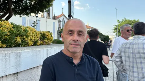 Diogo Jota and André Silva's funeral held in Portugal Sofia Ferreira Santos/BBC A bald man standing in front of a white church