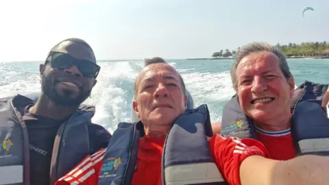 Extreme sex and bodies in suitcases Albert Alfonso/Flickr Yostin Mosquera (Left), Albert Alfonso (Middle) and Paul Longworth (Right) on a speedboat. They are wearing lifejackets and smiling at the camera. There is clear blue sea behind them with the wake of the waves. In the distance palm trees can be seen on the shore line.