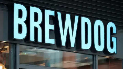 Brewdog to close 10 pubs across UK, some 'within days' PA The word 'Brewdog' in bold blue letters above a bar