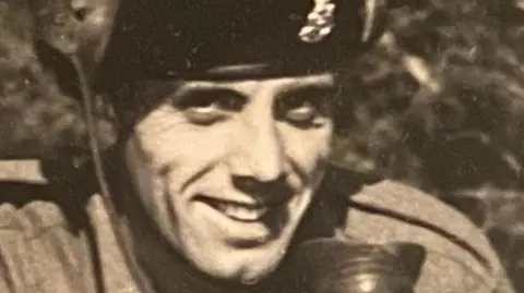 'Hospital gave us two death certificates for dad to cover up their mistake' Family handout A black and white picture of a man in military uniform. He is smiling at the camera and has a badge on his beret