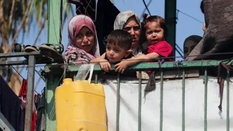 Gaza truce talks on verge of collapse, Palestinian officials say Reuters Palestinians look on at the site of an overnight Israeli strike on a school sheltering displaced families, in Gaza City