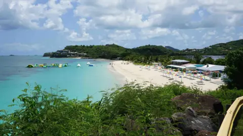The Caribbean islands that give you a passport if you buy a home A beach in Antigua