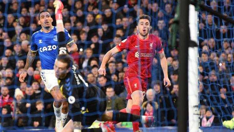 Diogo Jota death: Liverpool striker's best moments in pictures Diogo Jota sends a finish over Everton goalkeeper Jordan Pickford in December 2021.