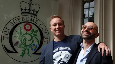 Why have bankers had convictions quashed and what happens next? EPA Tom Hayes with his arm around Carlo Palombo stand outside the Supreme Court, smiling