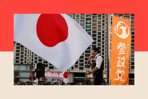 How Japan's far right was supercharged by Trump and tourists Reuters Japan's Sanseito party leader Sohei Kamiya delivers a speech during the party’s rally - large flag in the foreground and Sohei wears a white shirt and holds a microphone