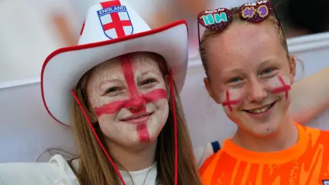 England fans on edge in tight Euro semi-final Getty Images A woman and a young girl are pictured wearing an England hat, novelty sunglasses and red and white face paint prior to the UEFA Women's Euro 2025 semi-final match between England and Italy at Stade de Geneve on July 22, 2025