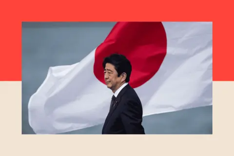 How Japan's far right was supercharged by Trump and tourists Getty Images Japanese Prime Minister Shinzo Abe at Joint Base Pearl Harbor, Hickam's Kilo Pier, on 27 December 2016 in Honolulu, Hawaii.