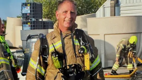 Peter Duncombe Peter Duncombe in his fire service uniform on his last call out on his last day as a retained firefighter