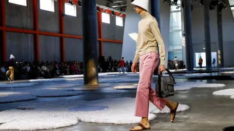 Why Indian footwear artisans are upset with the luxury Italian label Reuters A model wearing Prada walks on the runway at the Milan Fashion Week in June.