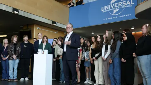 Universal UK could feature Europe's tallest rides PA Media Prime Minister Sir Keir Starmer speaking to a gathered crowd of young student during a visit to Bedford. A blue Universal banner is on the balcony behind him.