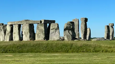 Your new banknote ideas - from British Bulldogs to Fawlty Towers Stonehenge under a blue sky with grass in front.