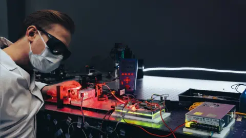 Space technology: Lithuania's promising space start-ups Astrolight A technician works with lasers at Astrolight's lab