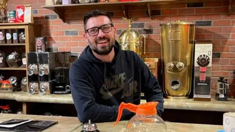 The big winner from Coca-Cola's Trump-inspired sugar push Jordan Hayes Jordan Hayes sits behind the coffee counter on the set of a Friends pop up in Dallas. He says he's a foodie who can taste the difference when Coke is made with sugar