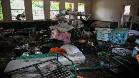A girls' summer camp cut short by deadly disaster Getty Images Scattered personal belongings