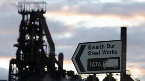 Tata Steel Port Talbot electric furnace work set to begin Reuters A silhouette of the steelworks machinery on a sunset sky with a road sign in the forefront which reads "steelworks, TATA".