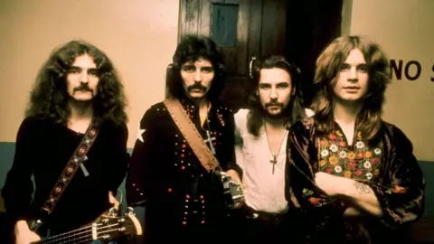 Black Sabbath's Iommi admits nerves ahead of farewell show Getty Images A yellowing photo of four men with long hair in dark tops with two of them holding guitars