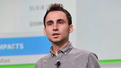 Musk's X appoints 'king of virality' in bid to boost growth Getty Images Nikita Bier, wearing a grey, button-up shirt with a microphone attached, speaks on-stage at TechCrunch Disrupt in 2013.