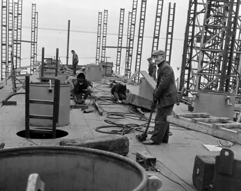 Trainspotting author Irvine Welsh says AI has made us dumbed down machines Henry Robb Ltd/SWNS Black and white photo of Workers in ship at the Henry Robb Ltd Ship Builders in Leith in 1964