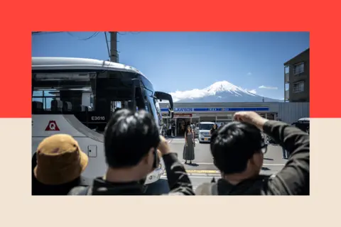 How Japan's far right was supercharged by Trump and tourists AFP via Getty Images Tourists take pictures from the opposite street of a convenience store with Mount Fuji on 3 May 2024.