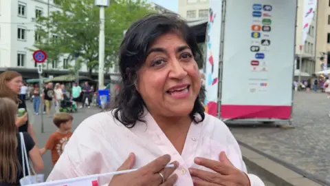 Bend It Like Beckham sequel in the works, director tells BBC Director Gurinder Chadha wears a pink shirt and holds a mini England flag as she speaks