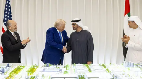 The Gulf bets big on AI as it seeks the 'new oil' WAM President Donald Trump (L) shakes the the hand of UAE president Sheikh Mohamed bin Zayed Al Nahyan as they unveil a 3D model of the new joint US-UAE AI campus.