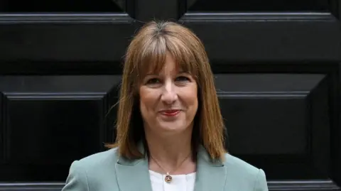 Peak Cluster carbon capture project 'could boost hundreds of jobs' Reuters Rachel Reeves stood in front of her house's black door