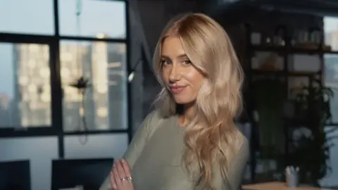 'I'm being paid to fix issues caused by AI' Sophie Warner Sophie Warner with long blonde hair