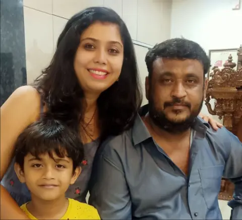 Families of Air India crash victims seek answers after report A family photo with Shweta Parihar and her husband, Abhinav Parishar, and their son Vihaan